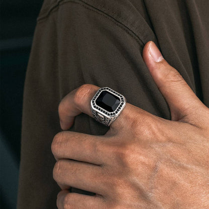 A Man Wearing X Bone Skull Black Onyx Ring