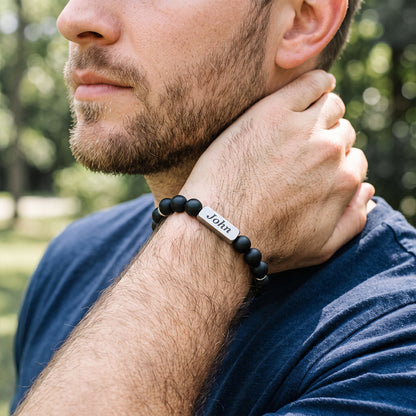 A Man in blue t shirt Wearing Custom Magnetic Hematite Beaded Bracelet