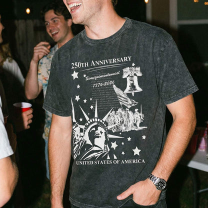 A Man wearing a t-shirt with '250th Anniversary' design, standing in a social setting.