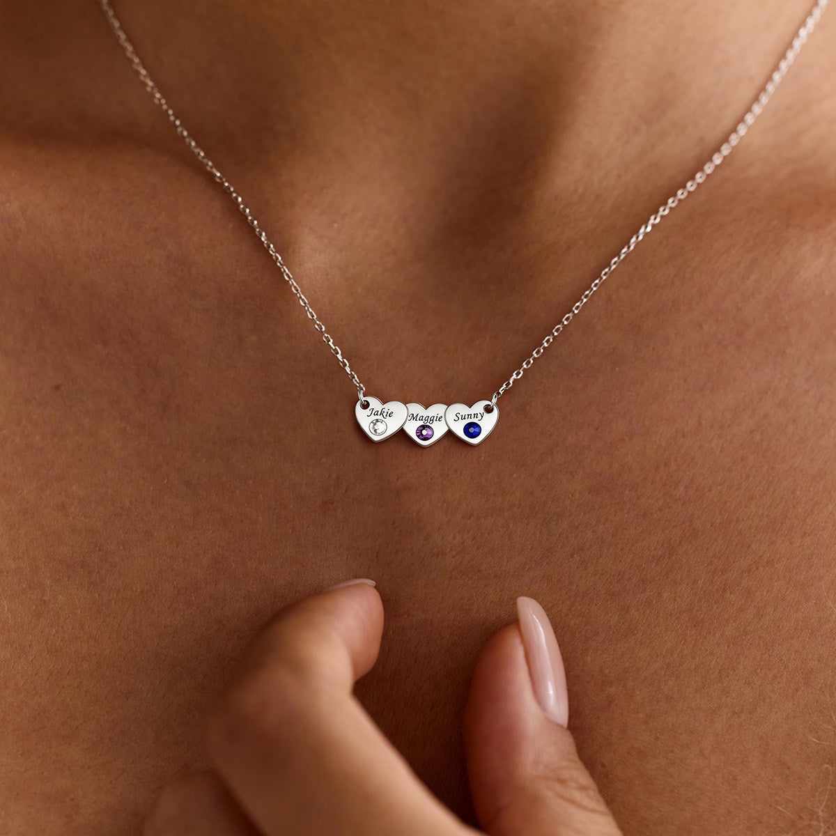 A Woman Wearing 3 Hearts Name Birthstone Necklace