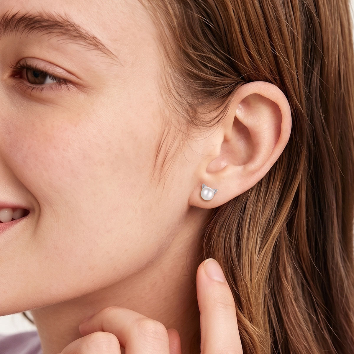 A Woman Wearing 925 Sterling Silver Cat Pearl  Stud Earrings 