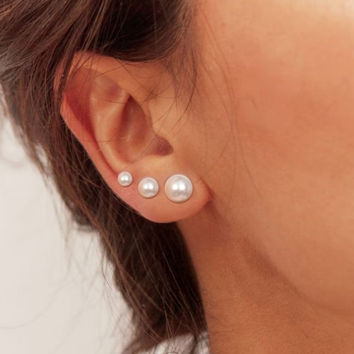 A Woman Wearing 925 Sterling Silver Freshwater Pearl Stud Earrings in different size