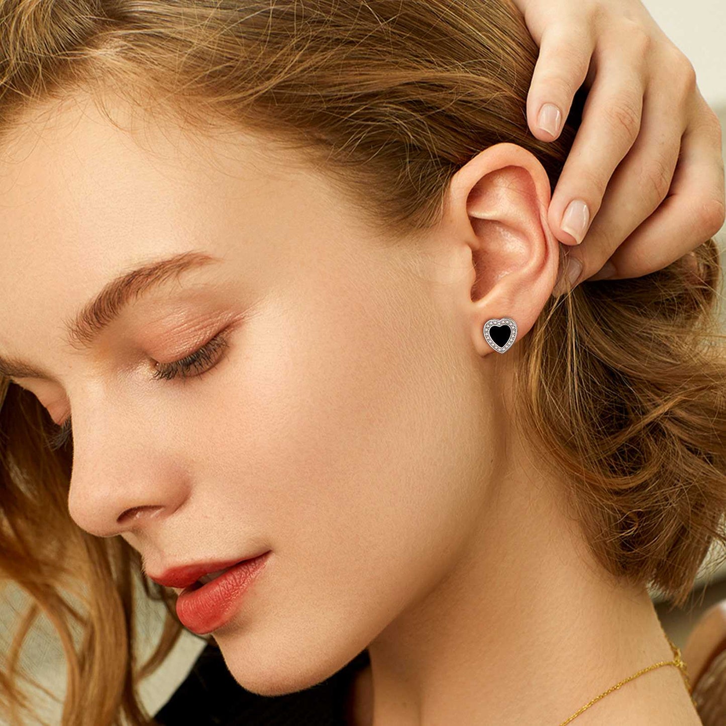 A Woman Wearing 925 Sterling Silver Heart Black Onyx Stud Earrings
