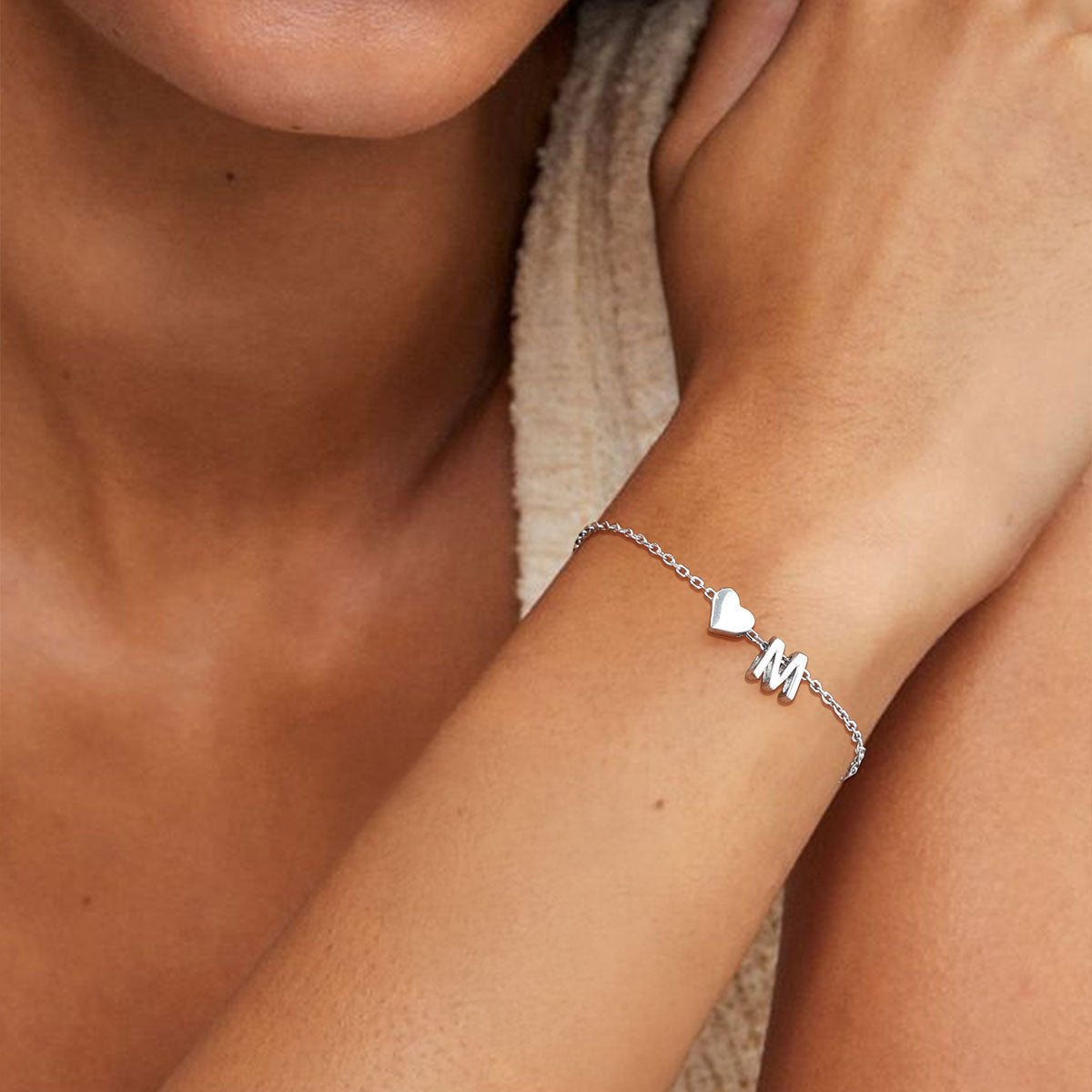 A Woman Wearing 925 Sterling Silver Initial Bracelet