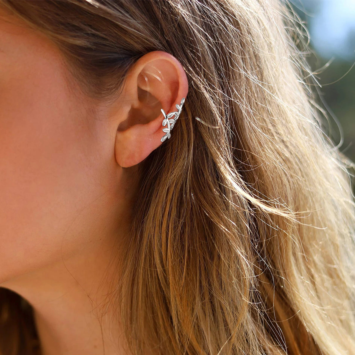 A Woman Wearing 925 Sterling Silver Leaf Ear Cuff Earrings