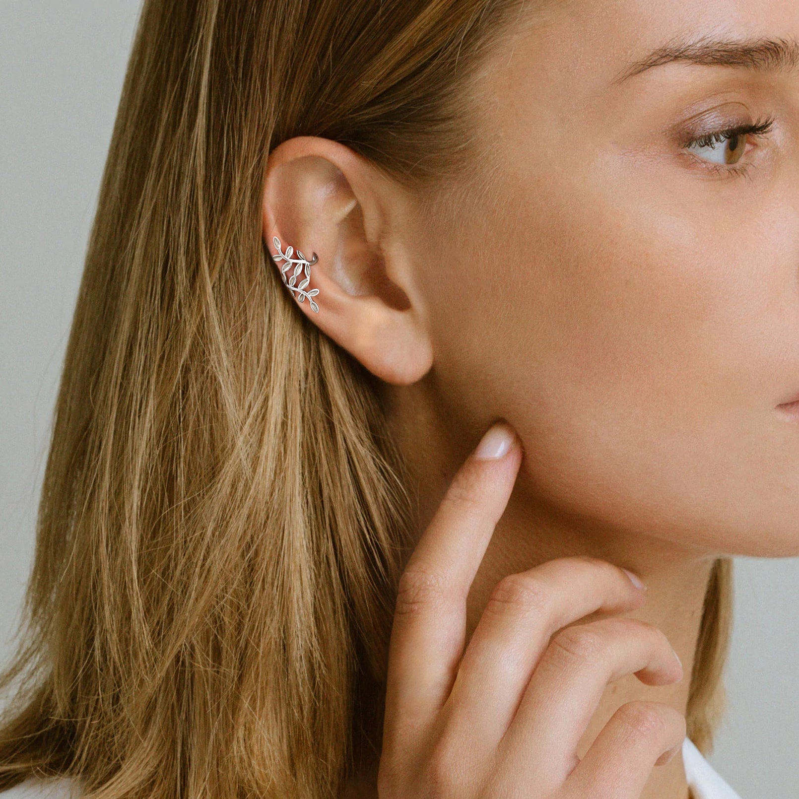 A Woman Wearing 925 Sterling Silver Leaf Ear Cuff Earrings Non Piercing 