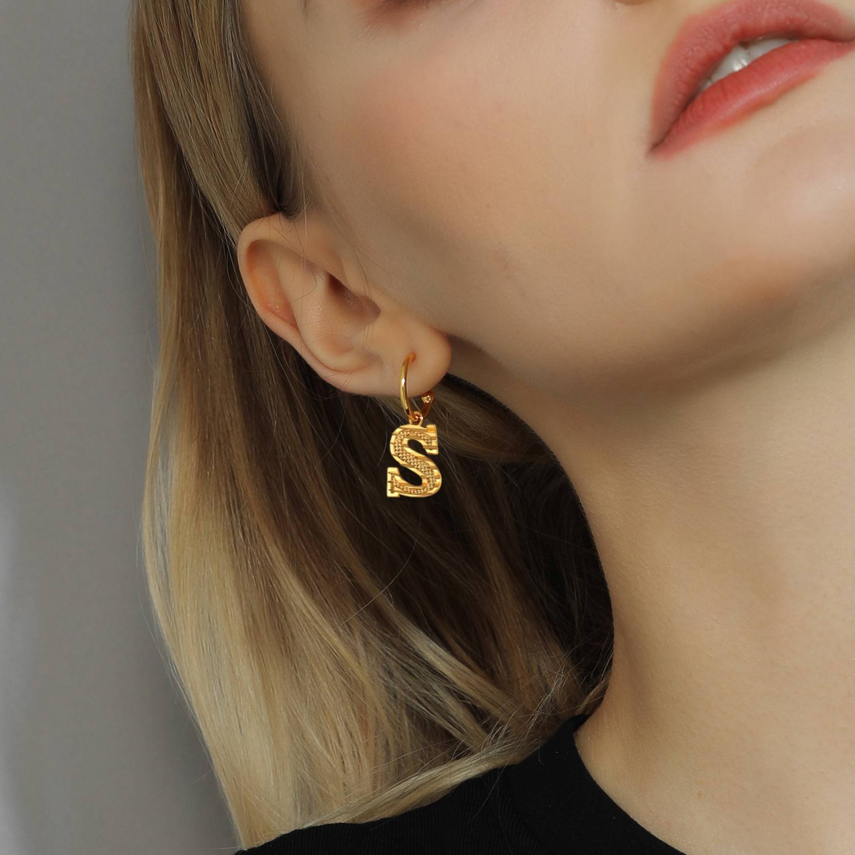 A Woman Wearing Alphabet Initial Hoop Earrings for Women