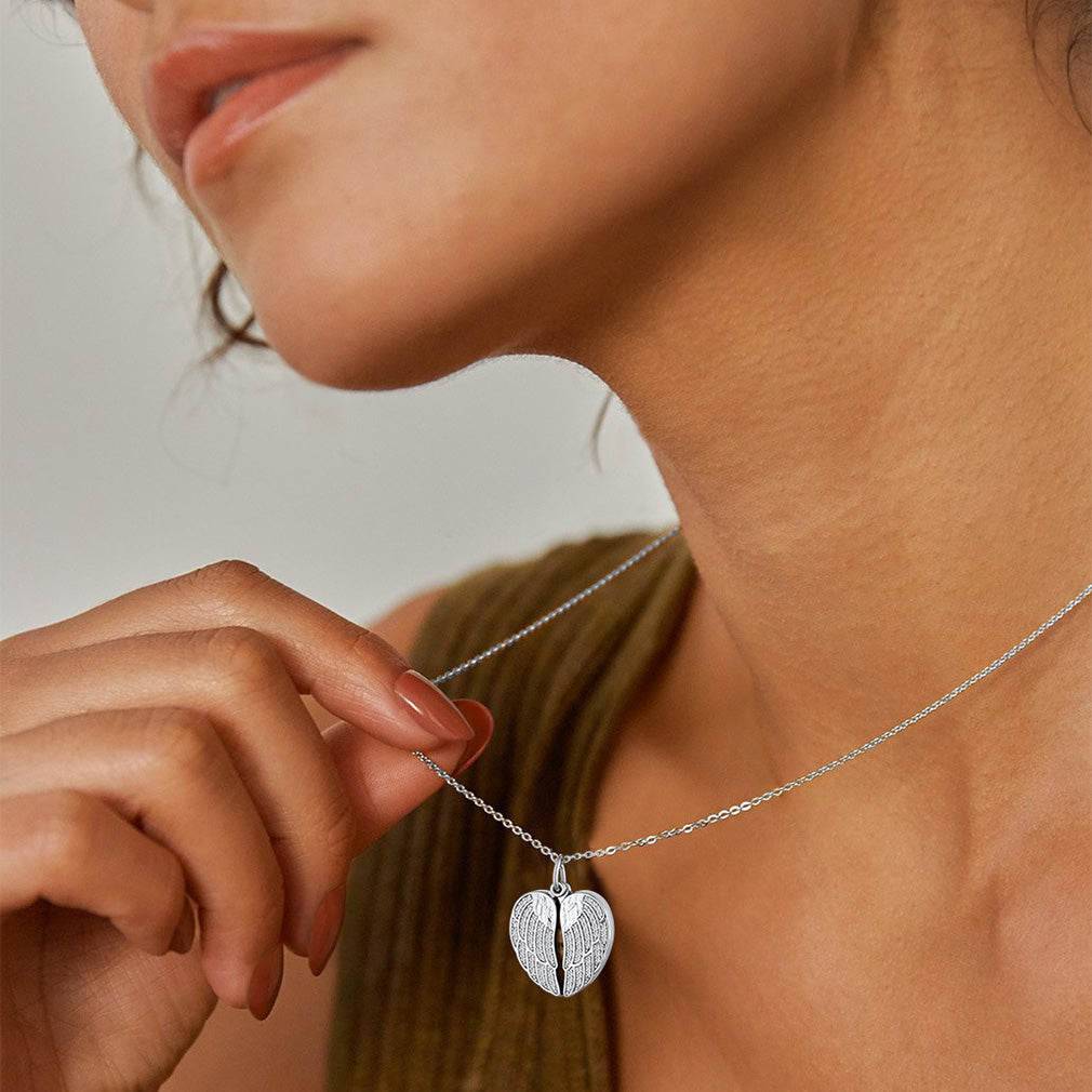 A Woman Wearing Angel Wings Heart Locket Necklace with Picture