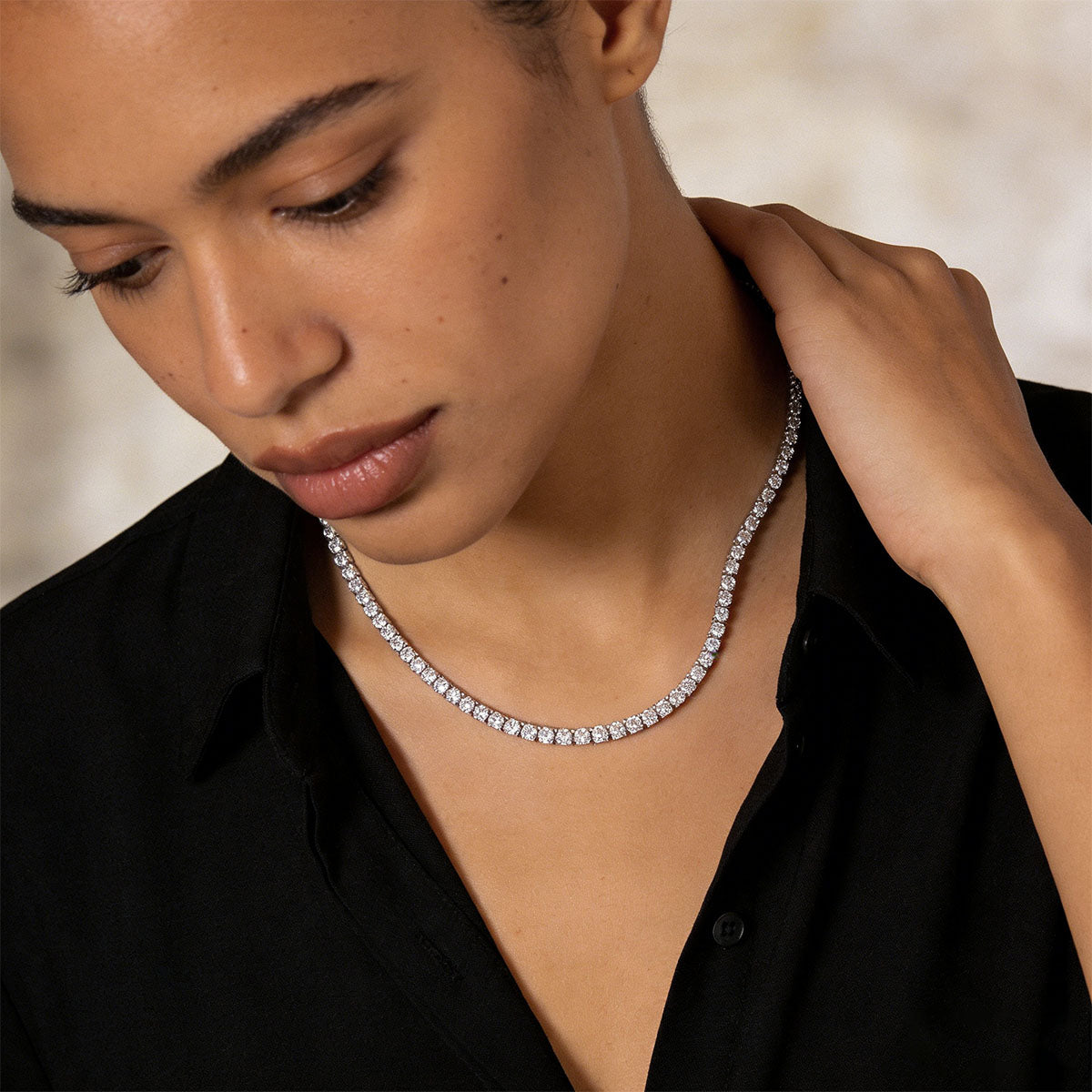 A Woman Wearing Black Cubic Zirconia Tennis Necklace