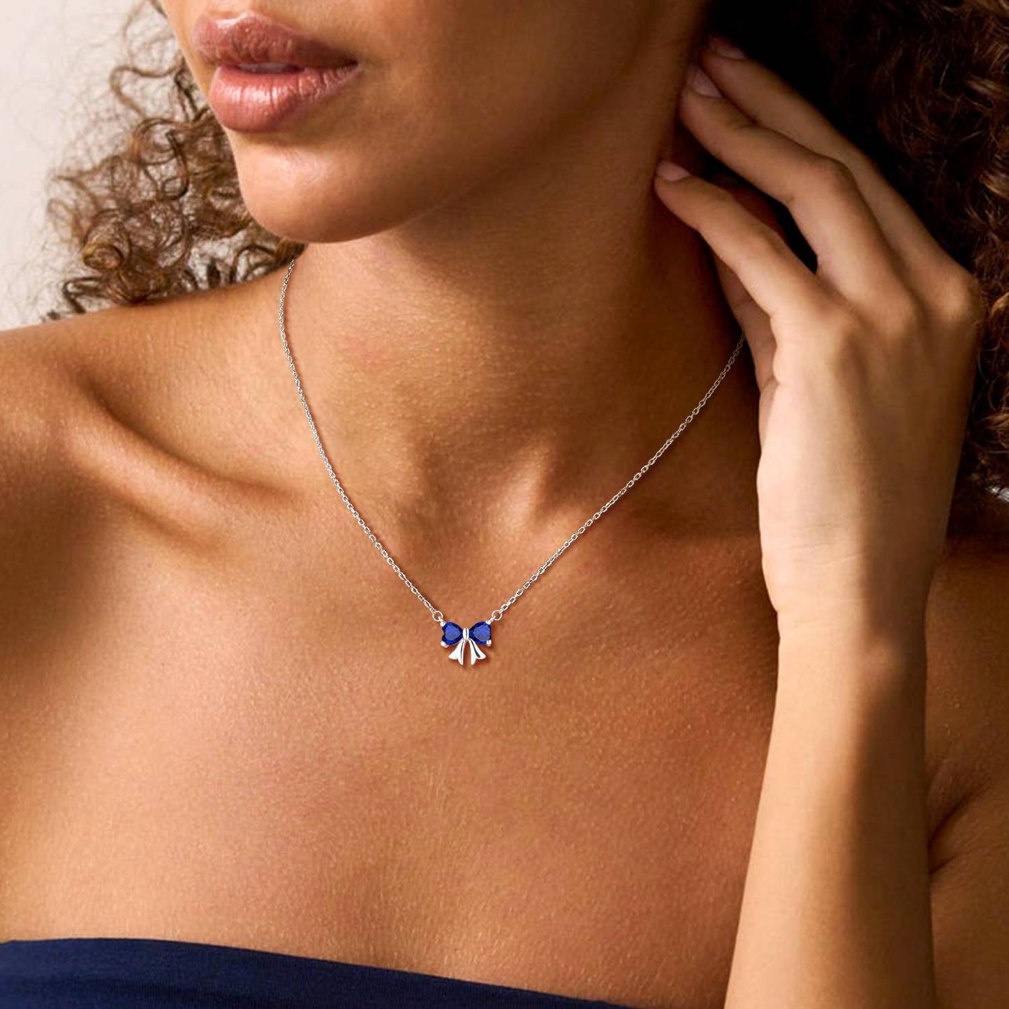A Woman Wearing Bow Birthstone Necklaces