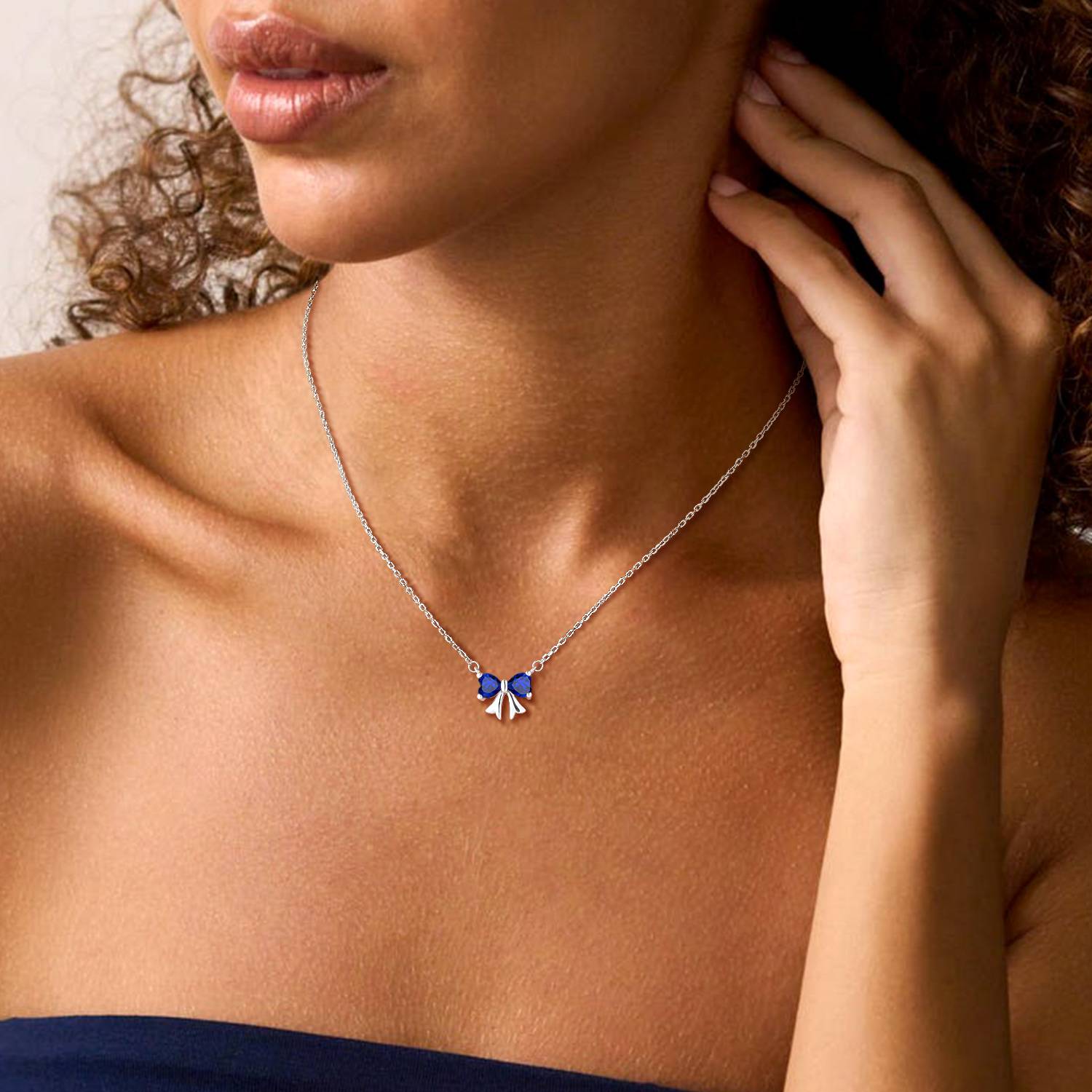 A Woman Wearing Bow Birthstone Necklaces