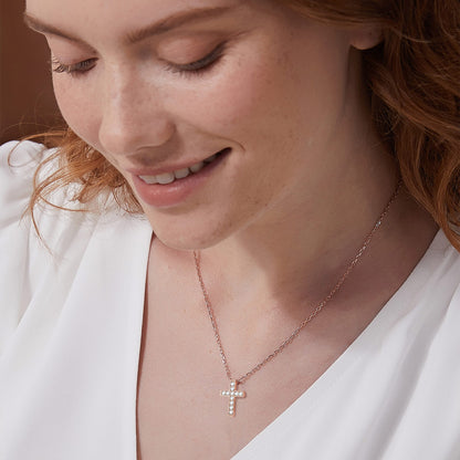 A Woman Wearing CZ Cross Necklace