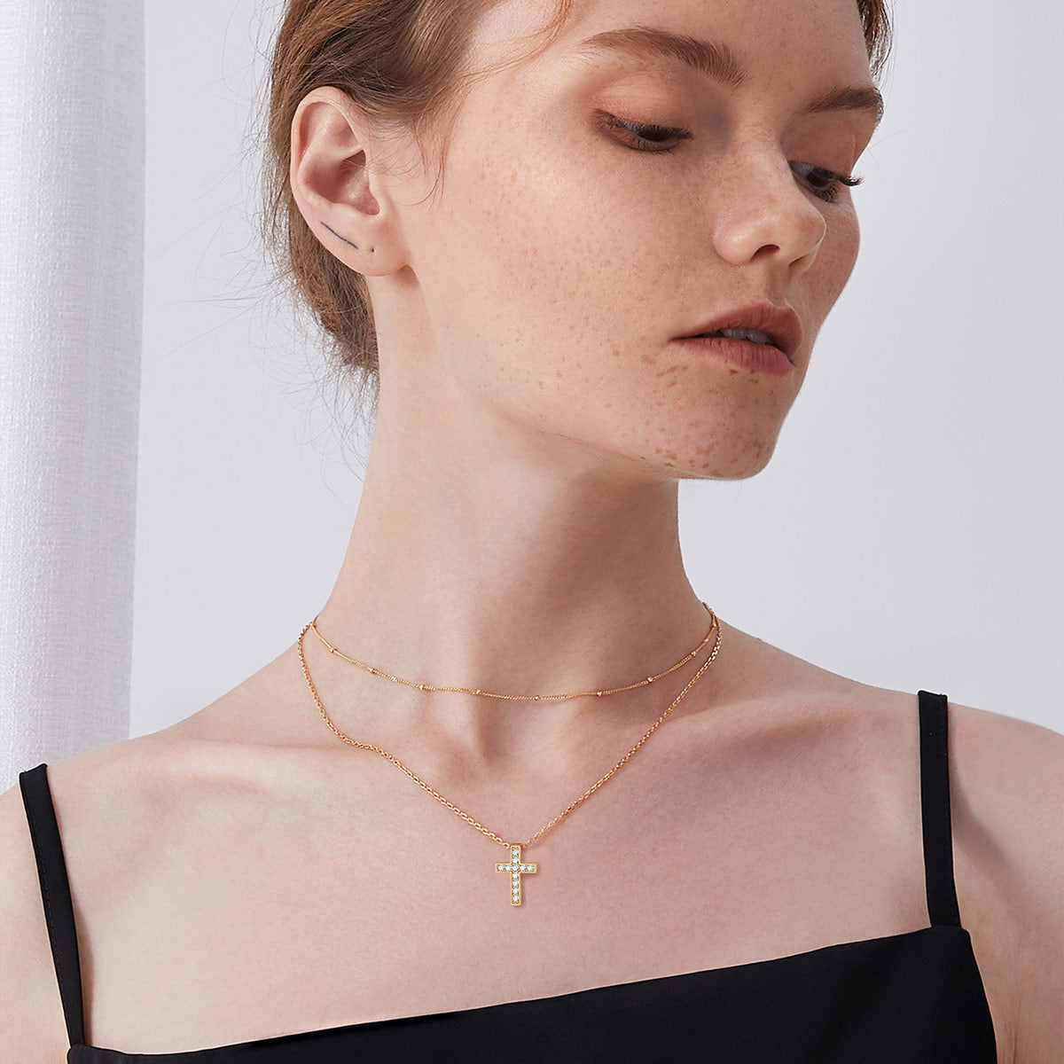 A Woman Wearing CZ Cross Necklace for Women