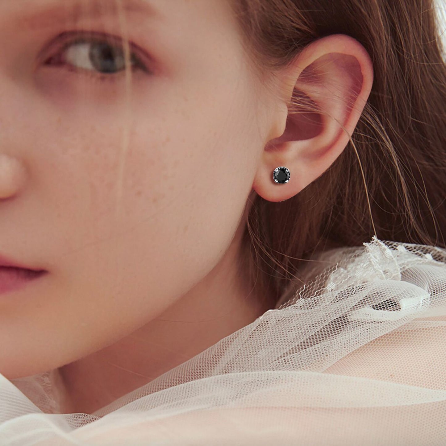 A Woman Wearing Celtic Knot Black Onyx CZ Stud Earrings in 925 Sterling Silver