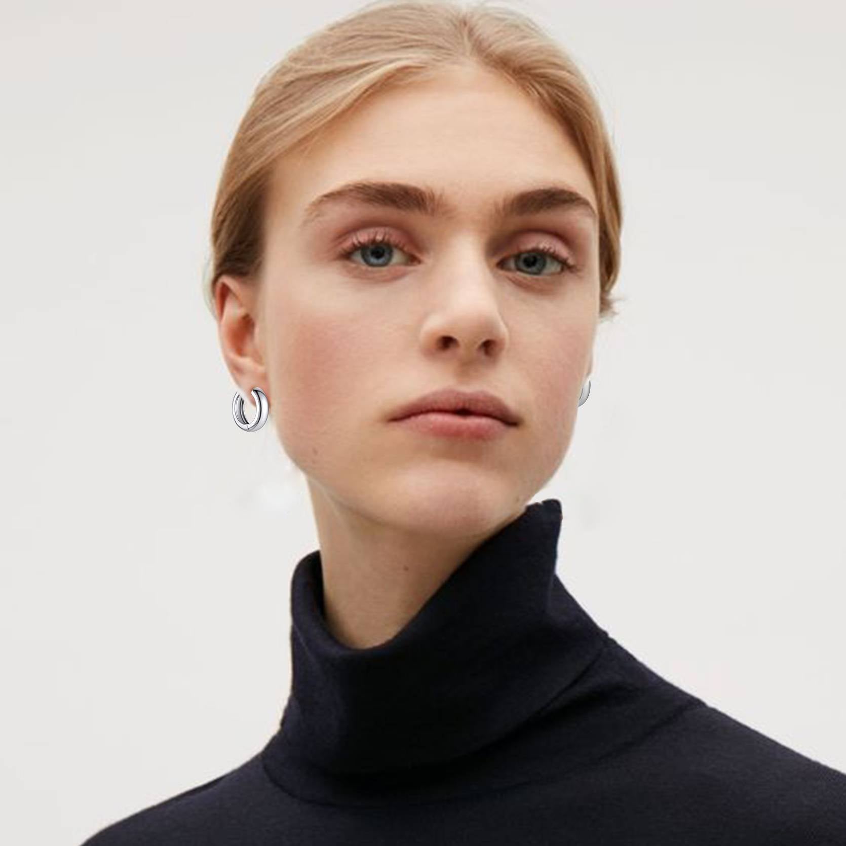 A Woman Wearing Classic Smooth Huggie Hoop Earrings