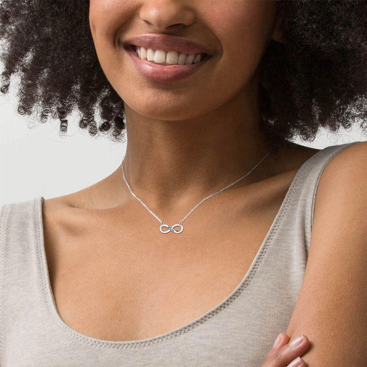 A Woman Wearing Custom Engravable Infinity Necklace in silver