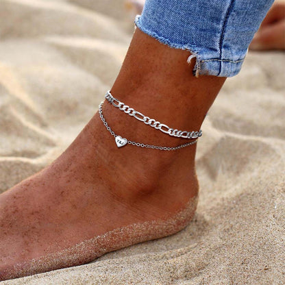 A Woman Wearing Custom Engraved Heart Anklets