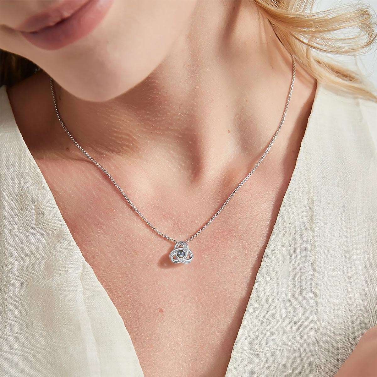 A Woman Wearing Custom Triple Love Knot Photo Projection Necklace