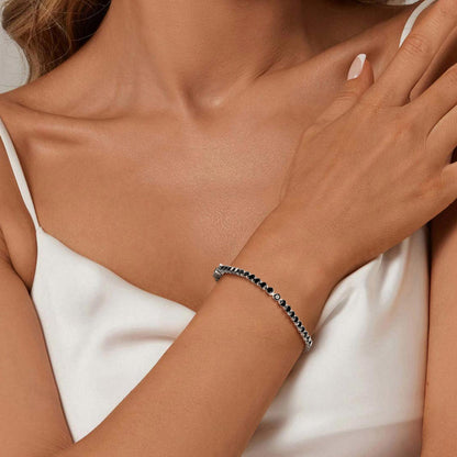 A Woman Wearing Dainty Black Cubic Zirconia Tennis Bracelet
