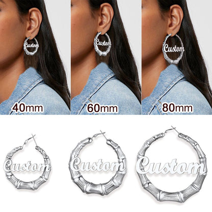 A Woman Wearing Different Size of Name Bamboo Hoop Earrings