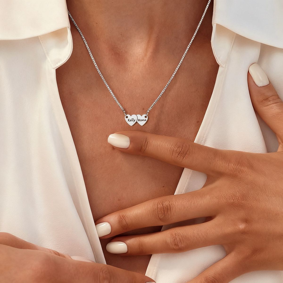 A Woman Wearing Engraved 2 Hearts Name Necklace
