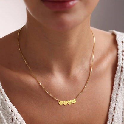 A Woman Wearing Engraved 4 Hearts Name Necklace