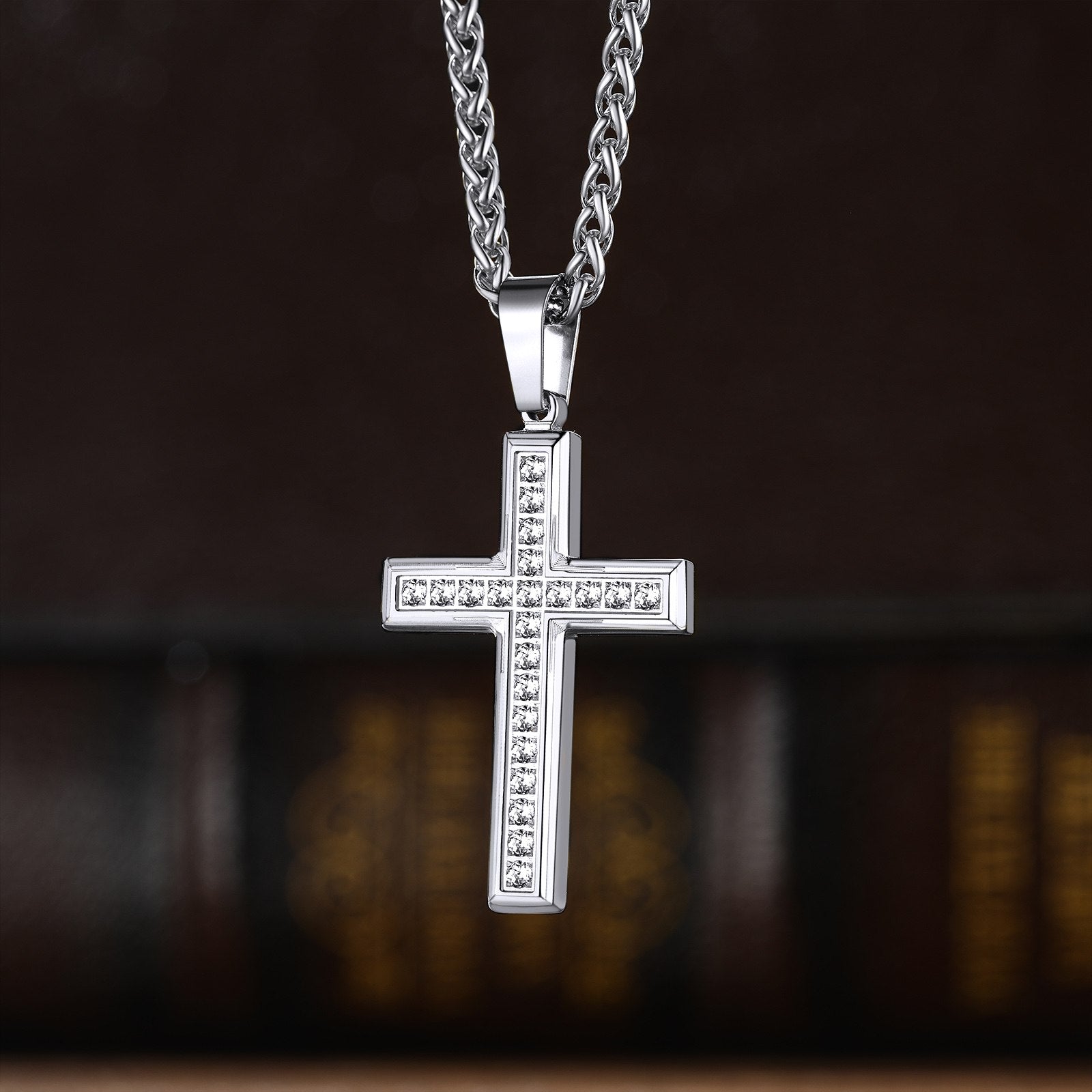 A Woman Wearing Engraved Cubic Zirconia Cross Necklace in Steel