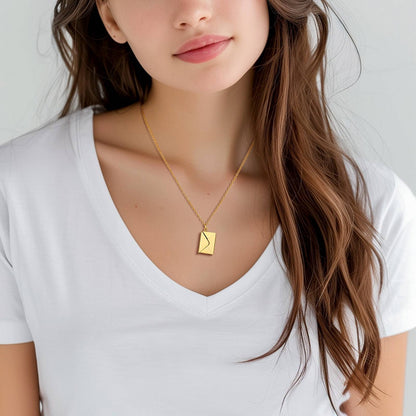 A Woman Wearing Engraved Envelope Locket Necklace