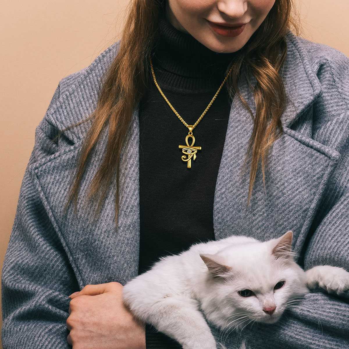A Woman Wearing Eye of Horus Ankh Cross Necklace
