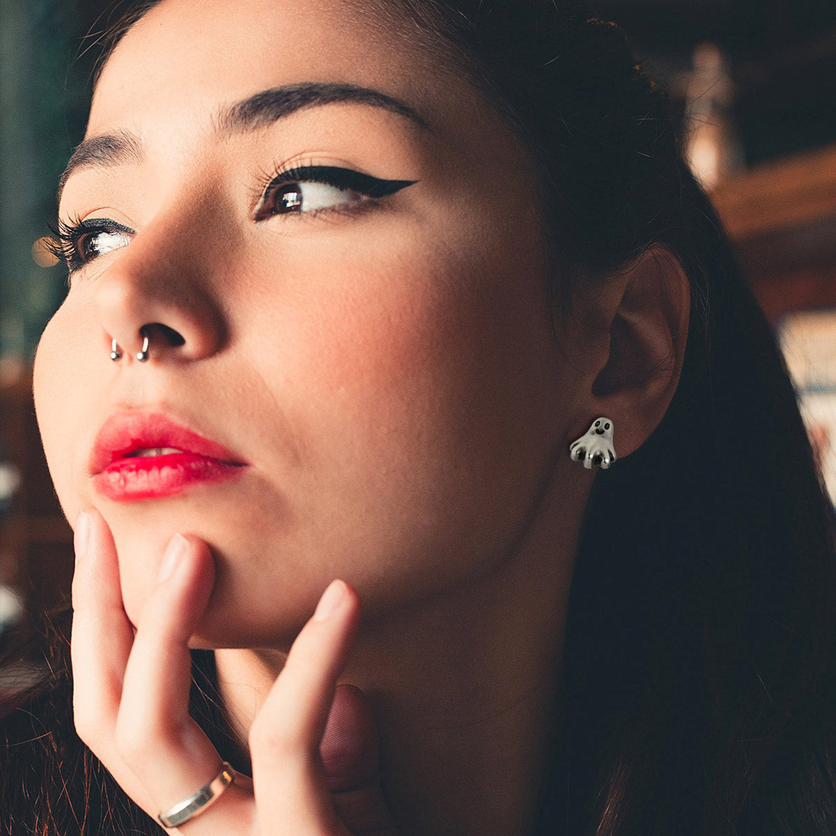A Woman Wearing  Ghost Stud Earrings