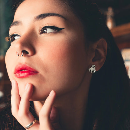 A Woman Wearing  Ghost Stud Earrings