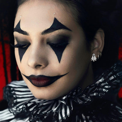 A Woman Wearing Halloween Ghost Stud Earrings