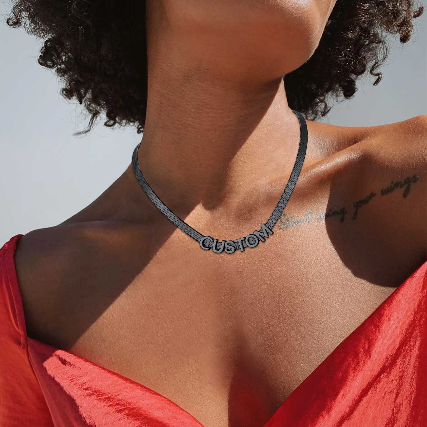 A Woman Wearing Initial Herringbone Choker Necklace Snake Chain Necklace