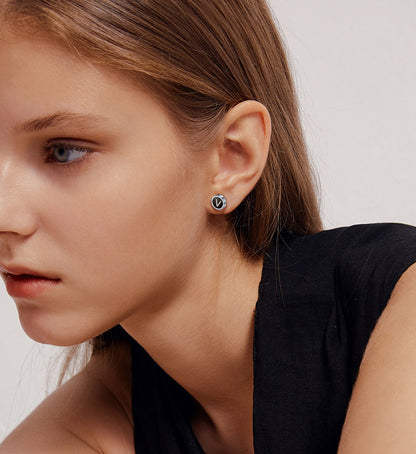 A Woman Wearing Initial Stud Earrings for Women Men