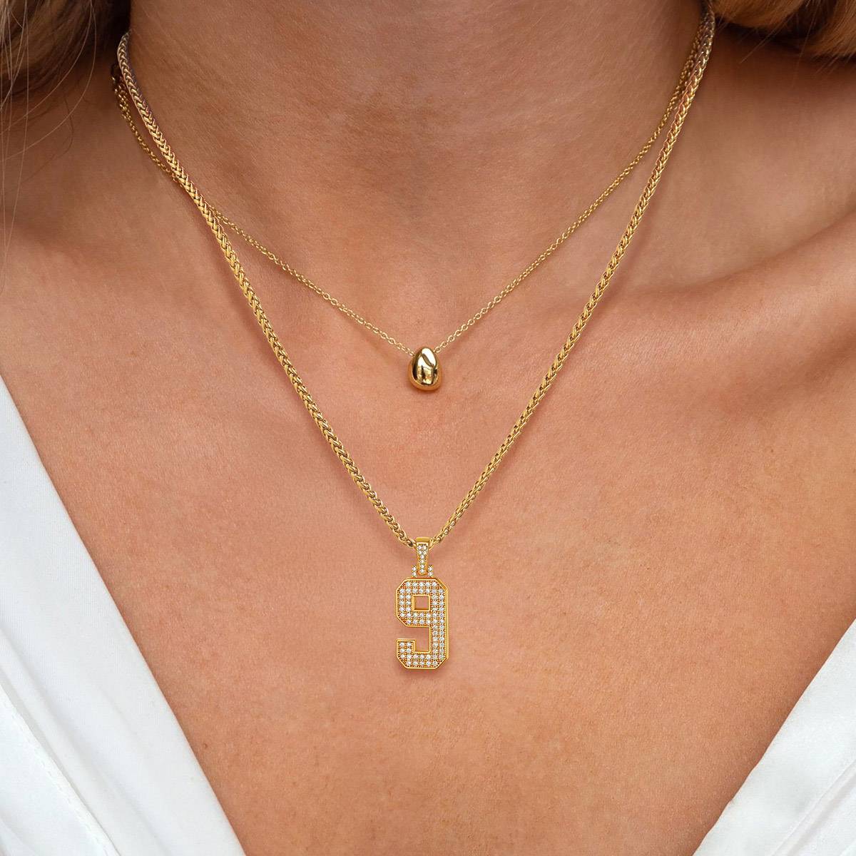A Woman Wearing Jersey 0-9 Number Necklace