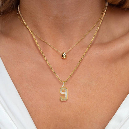 A Woman Wearing Jersey 0-9 Number Necklace