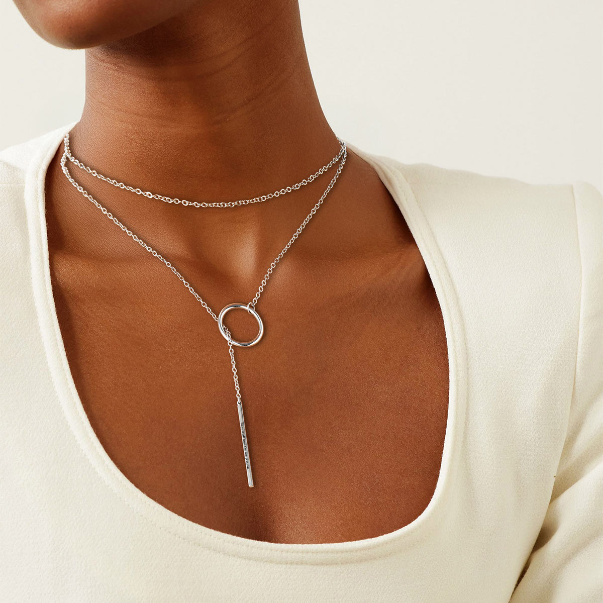 A Woman Wearing Lariat Open Circle Y Necklaces Bar Long Necklaces