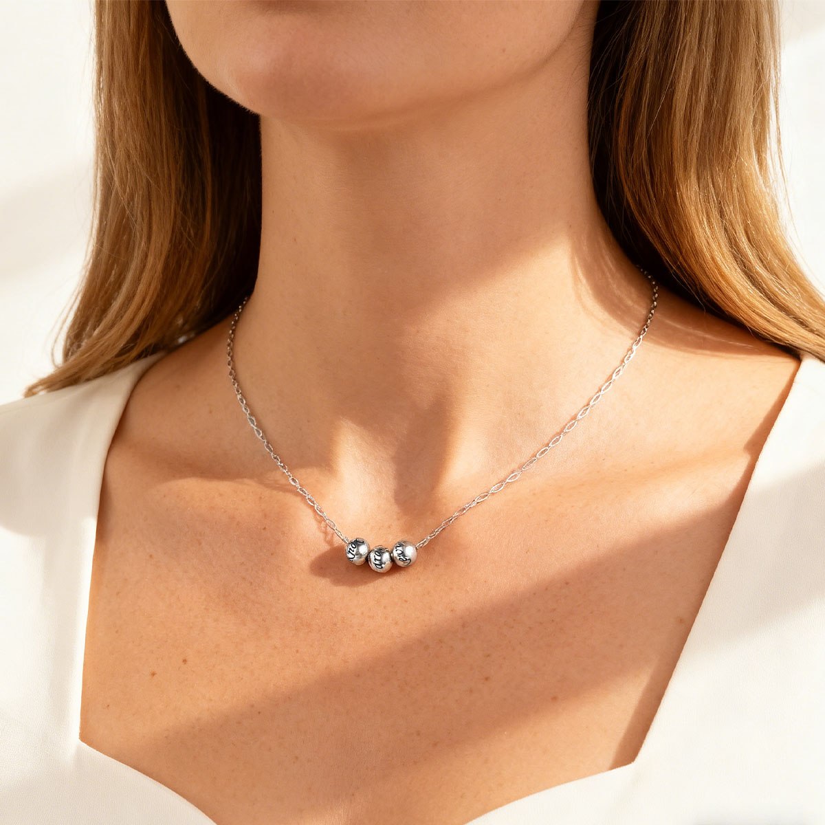 A Woman Wearing Name 3 Bead Balls Necklace