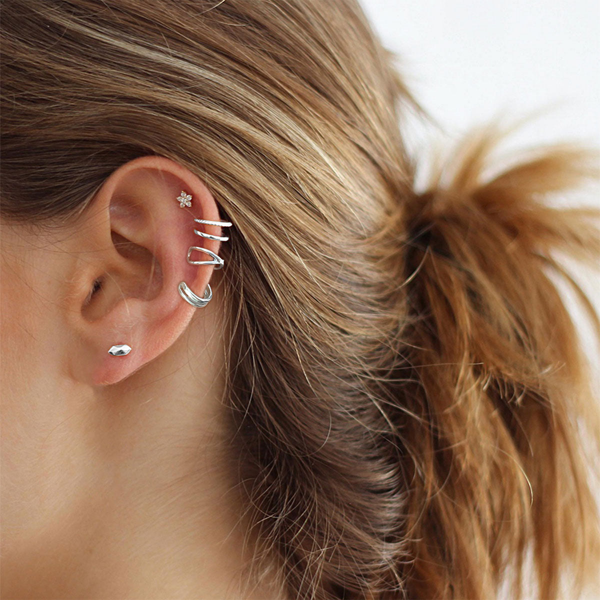 A Woman Wearing Silver Ear Cuff Earrings Set Non Piercing
