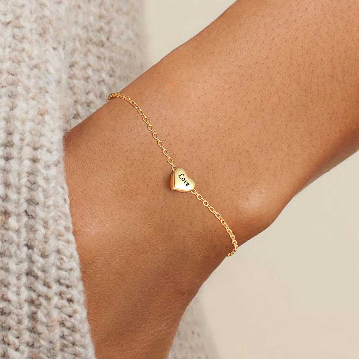 A Woman Wearing Silve Tiny Heart Bracelet