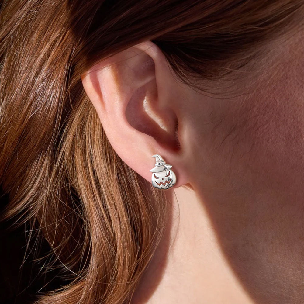 A Woman Wearing Skellington Stud Earrings