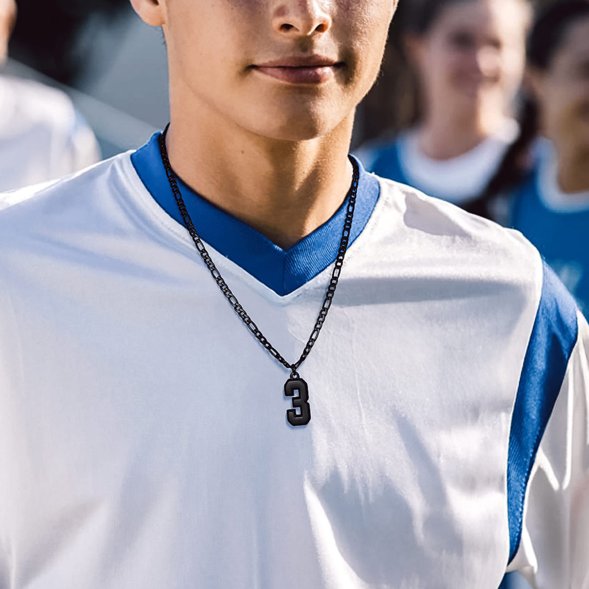 A Woman Wearing Sport Number Figaro Chain Necklaces