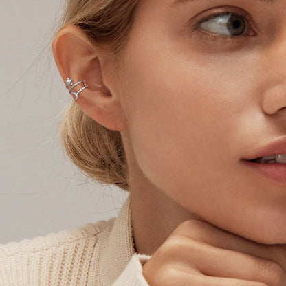 A Woman Wearing Star Moon Ear Cuff Earrings