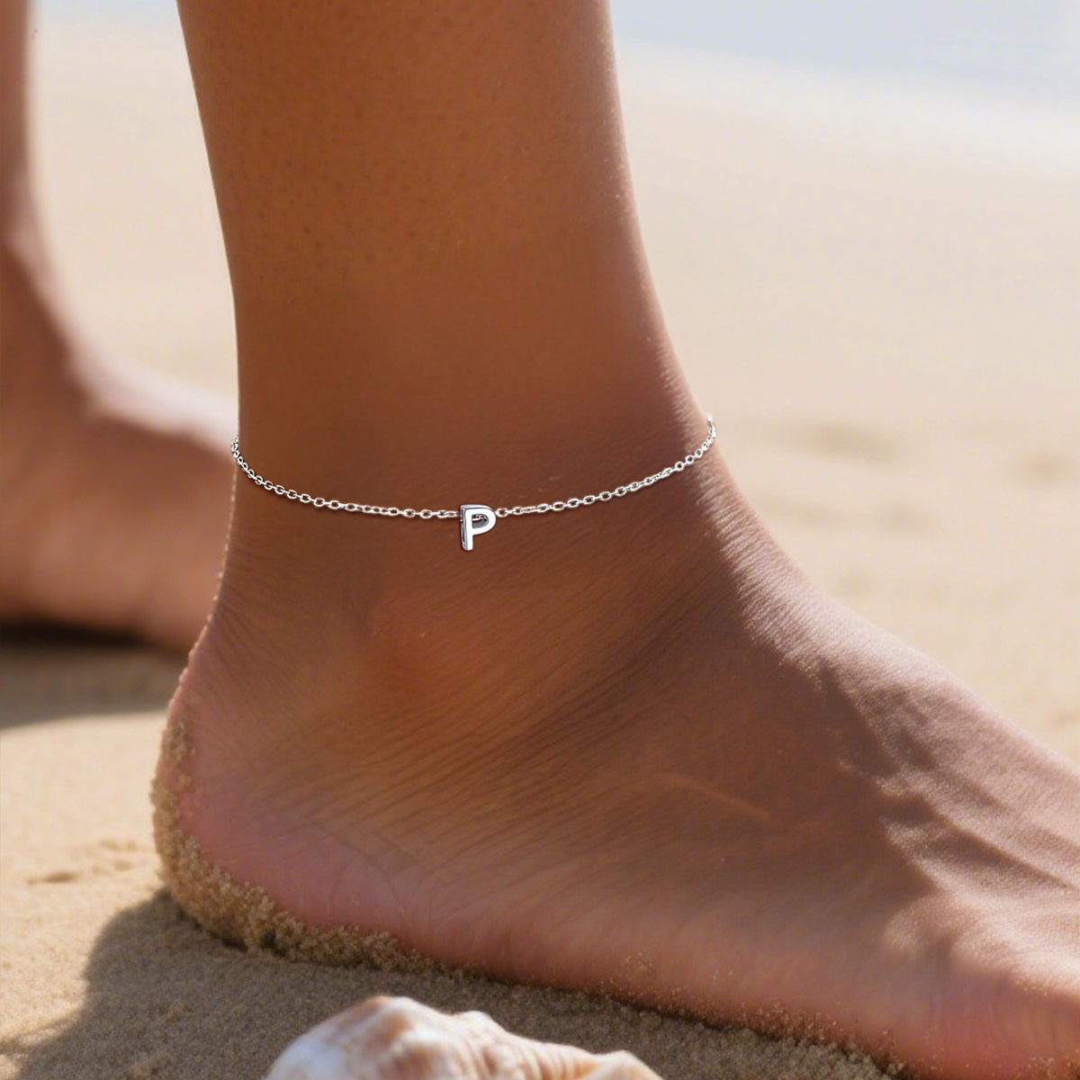 A Woman Wearing Sterling Silver Initial Anklets