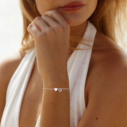 A Woman Wearing Sterling Silver Initial Bracelet