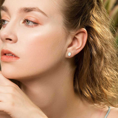 A Woman Wearing Sterling Silver Opal Stud Earrings