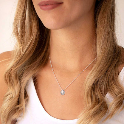 A Woman Wearing Teardrop CZ Necklace