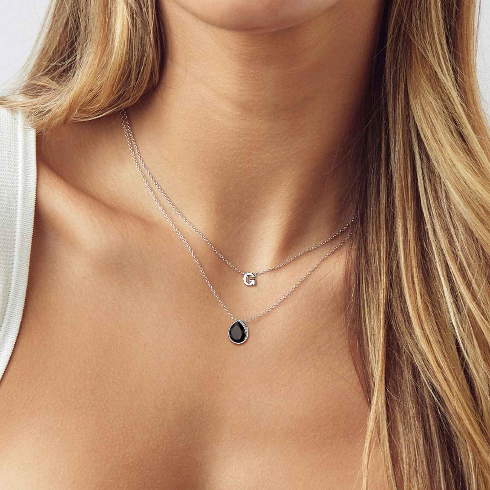 A Woman Wearing Teardrop Cubic Zirconia Necklace