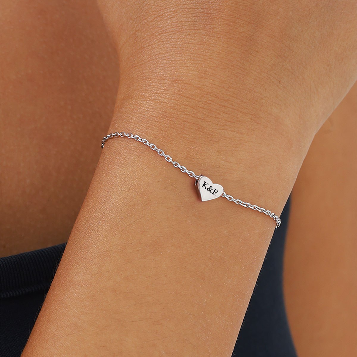 A Woman Wearing Tiny Heart Bracelet for Women in 925 Sterling Silver
