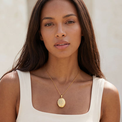 A Woman Wearing Vintage Oval Photo Locket Necklace